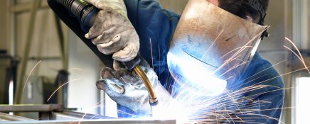 welder works in metal construction - construction and processing of steel components